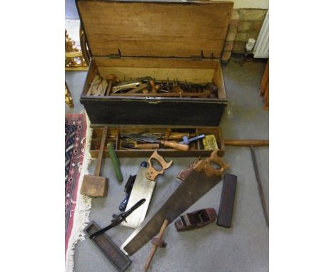 A Victorian tool chest with a selection of woodworking planes, chisels and other tools