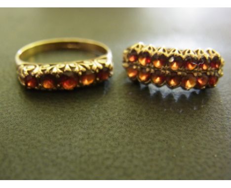 Two Victorian style 9 ct gold and garnet dress rings - one set with five stones in a single row - size R, the second with fou