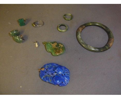 A collection of eight pieces of hardstone jewellery including Jade or Jadeite - some pieces with silver mounts and two pendan