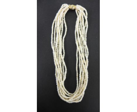 A freshwater cultured pearl eight-row necklace - To the grooved barrel clasp stamped 9K - Length 44cms
Condition Report: Good