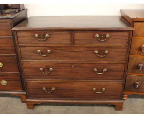 A George III mahogany chest, of two short and three long graduated drawers, raised on bracket feet, 110cm wide