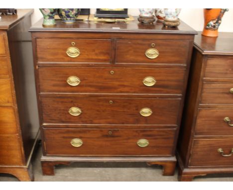 A Georgian mahogany chest, fitted two short and three long drawers, raised on bracket supports, 96cm wide