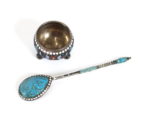 A Russian silver and enamel decorated salt, raised on ball feet; and a similar spoon with filigree work decoration and twist 
