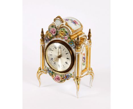 A 20th Century Dresden porcelain mantel clock, having floral encrusted decoration, 22cm high