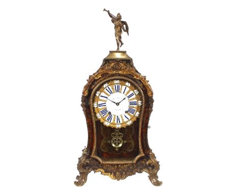 A large 18th Century French bracket clock,&nbsp;in the manner of Boulle, having tortoise shell and cut brass inlaid decoratio