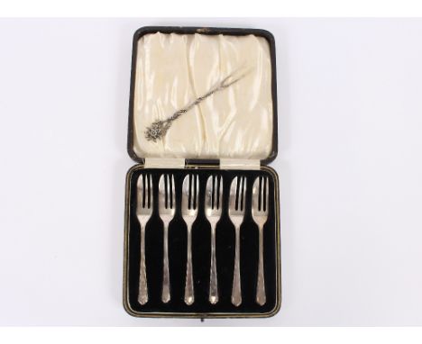 A cased set of six silver cake forks, Birmingham 1934; and a continental white metal pickle fork