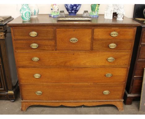 A 19th Century mahogany chest, fitted five short drawers above three long graduated drawers, raised on a shaped apron and bra