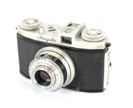A Regula leather cased camera, complete with some accessories; and a small Ulca miniature camera, AF