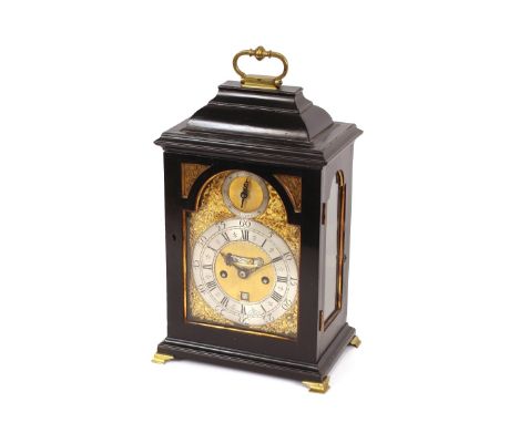 George Etherington of London, a table&nbsp;clock in ebonised case, fitted with brass carrying handle to the domed top above a