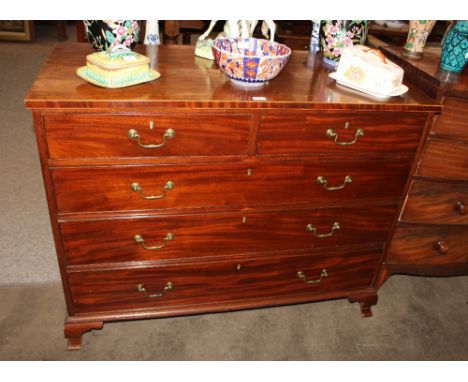 A George III mahogany and boxwood strung chest, of two short and three long drawers, raised on ogee bracket supports, 124cm w