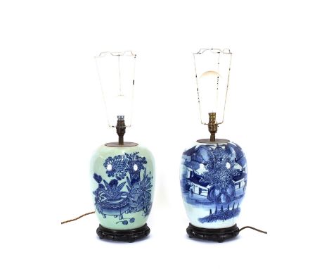 A Chinese blue and white table lamp base, decorated with figures and landscapes, raised on a circular carved hardwood pierced