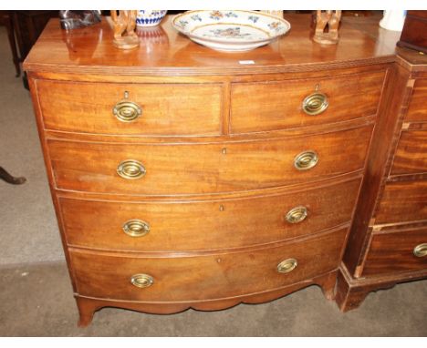 A 19th Century mahogany bow fronted chest, of two short and three long graduated drawers, raised on a shaped apron and bracke