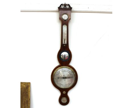 A 19th Century mahogany and boxwood strung banjo barometer, surmounted by a scrolled arch pediment and brass finial, silvered