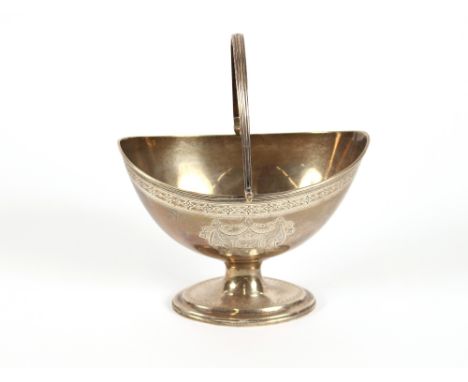 A George III silver oval sugar basket, of pedestal form having reeded swing handle, foliate engraved body with central cartou