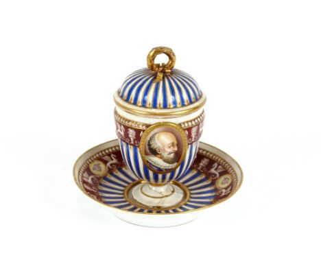 A German porcelain chocolate cup and cover, with classical decoration, inscribed "Henri IV"; a continental porcelain figure g