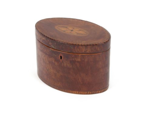 An 18th Century mahogany elliptical tea caddy, the lid with oval shell paterae, chequer banded, 16cm