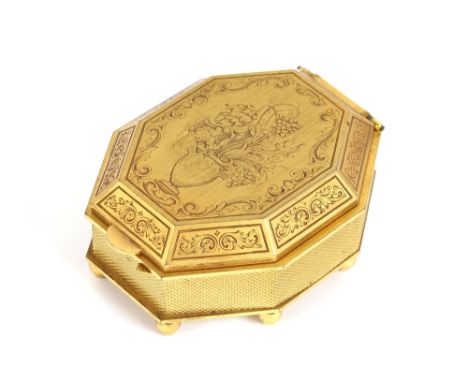 A vintage Swiss mechanical travelling clock, in gilt engraved case