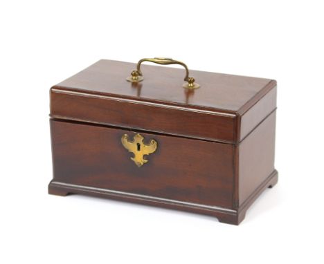 A George III mahogany tea caddy, the hinged lid opening to reveal a triple compartment interior, brass handle and escutcheon,