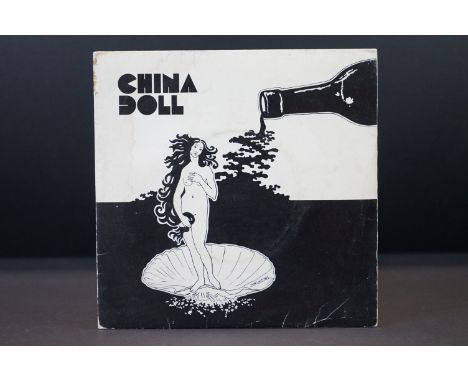 Vinyl - China Doll Oysters &amp; Wine / Past Tense 7" single on Wessex Records WEX 273.  Picture sleeve, plain white inner.  