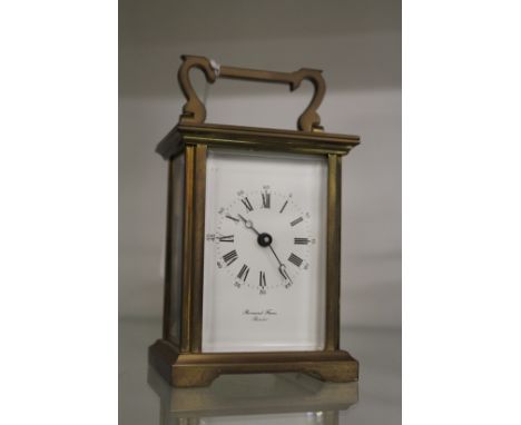 A brass carriage clock.