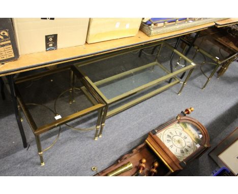 A brass and glass two tier coffee table and a pair of matching lamp tables.