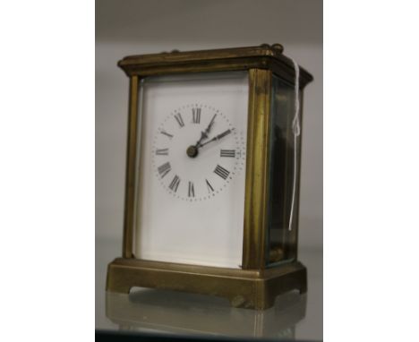 A brass carriage clock.