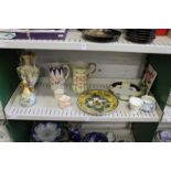 A shelf of decorative china.
