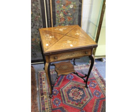 A good late Victorian inlaid rosewood envelope card table.