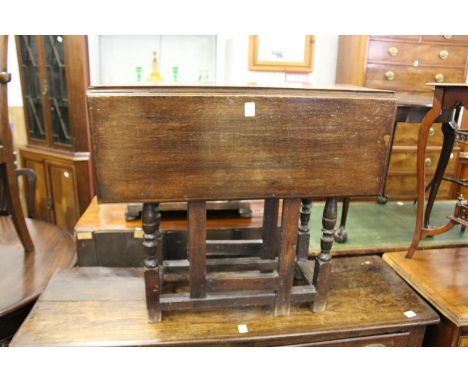 A small oak drop leaf gate leg table.