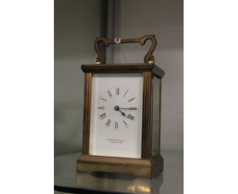 A brass carriage clock.