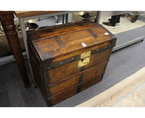 A good small dome top trunk with brass metal fittings.