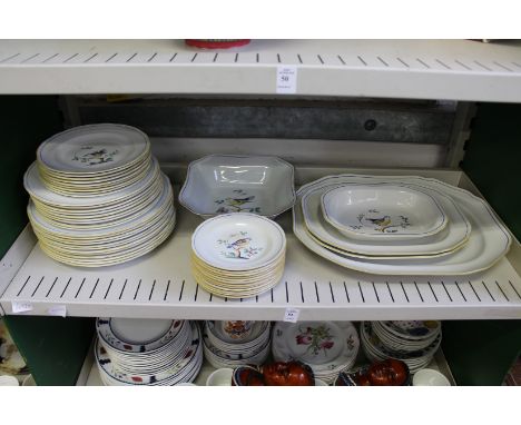 A quantity of Spode Queen's Bird china to include numerous plates and serving dishes.