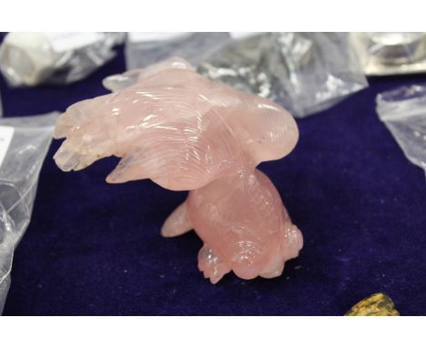 A Chinese rose quartz model of a fish.