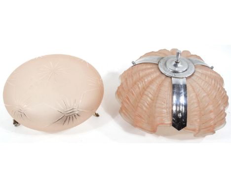 An Art Deco pink glass three section shell shaped ceiling light, 32cm dia., and a further pink glass ceiling light, 30cm dia.