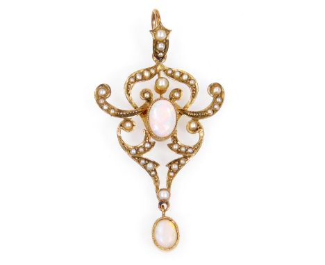 A early 20thC Art Nouveau drop pendant, of shaped scroll outline, centred with an oval opal, with a further drop opal and sma