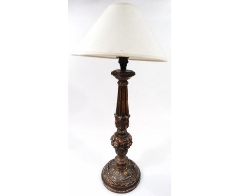 A 20thC carved giltwood table lamp,  in classical style, with acanthus leaf banding, on a leaf base, with modern electrical f