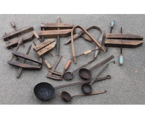 An early 20thC partially named kiln or furnace ladle,  with a plain bowl, shaped handle and hook end, 29cm high, various othe