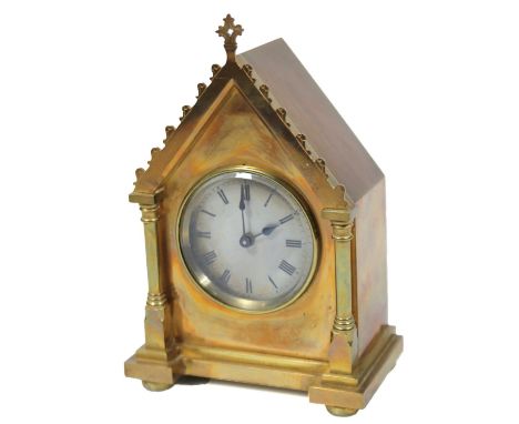 An early 20thC polished brass mantel clock, the architectural case holding a 7cm dia. Roman numeric dial fronting a keywind m