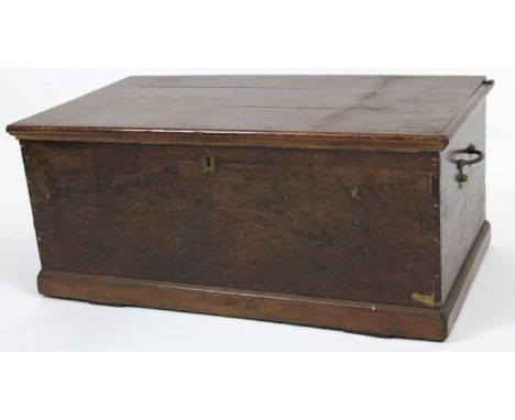 A late 19thC stained plank top tool chest, with side metal carrying handles and part fitted interior, 41cm H, 88cm W, 52cm D.