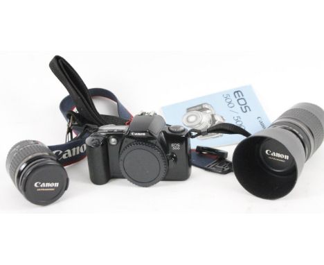 A Canon EO500 camera and two lenses, Ultrasonic 1:5-3.5-5.6, 11cm high, etc. 