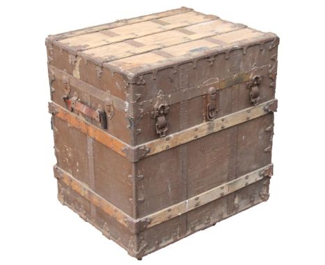 A C A Taylor Chicago and New York travel trunk, partially wooden and metal bound, labelled with three exterior heavy locks, 7