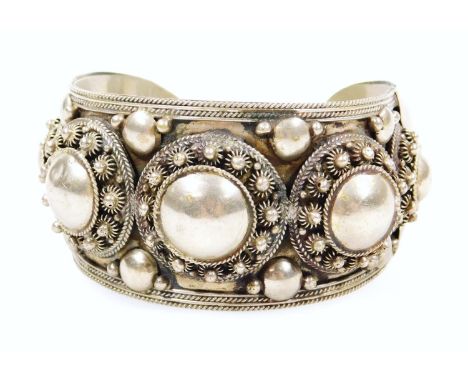 A Middle Eastern bangle, with star design, white metal, marked Siam Sterling. (AF)