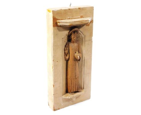 A solid oak stained ecclesiastical panel, formed with Apostle beneath shelf, on a block back, probably a maquette, 39cm high,