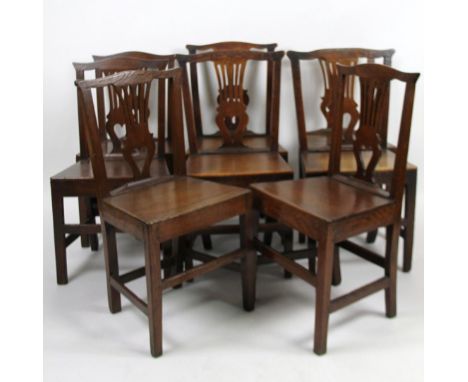 A Harlequin set of eight 19thC oak country Chippendale style chairs, with overhanging ear tops, inverted pierced heart shaped