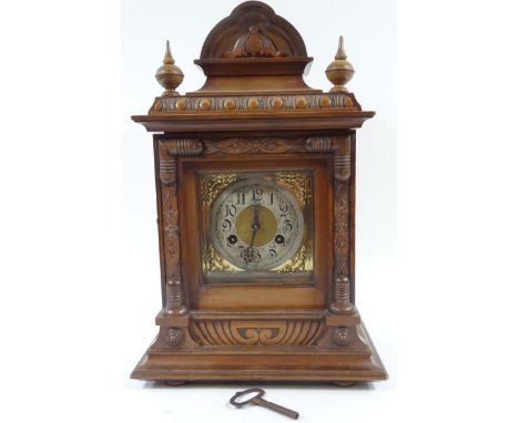 A late 19thC German walnut mantel clock, the square brass dial with silvered chapter ring with Arabic numerals, 8-day movemen