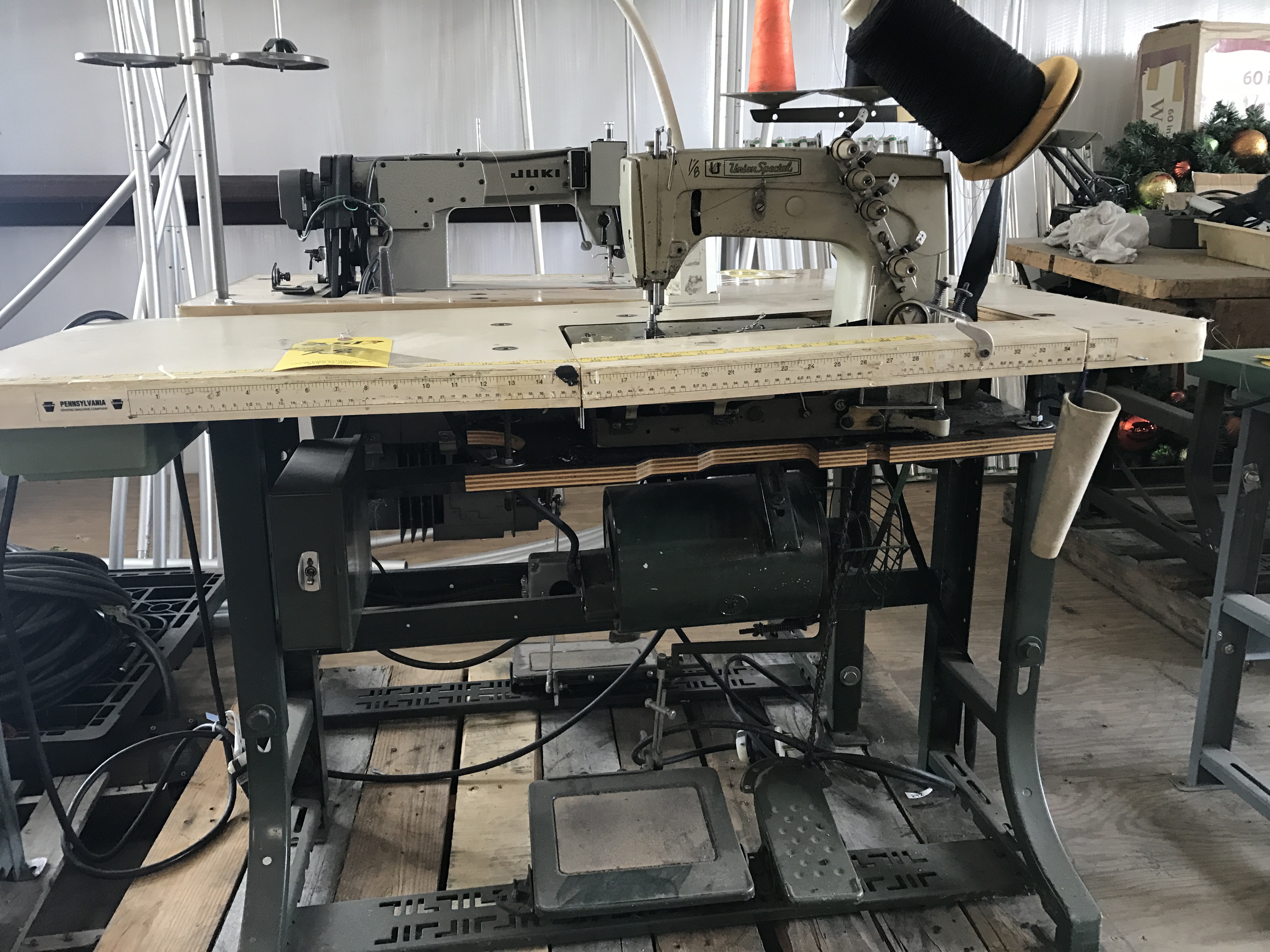 UNION SPECIAL INDUSTRIAL SEWING MACHINE MOD. 57800 W MACHINE WAS BEING