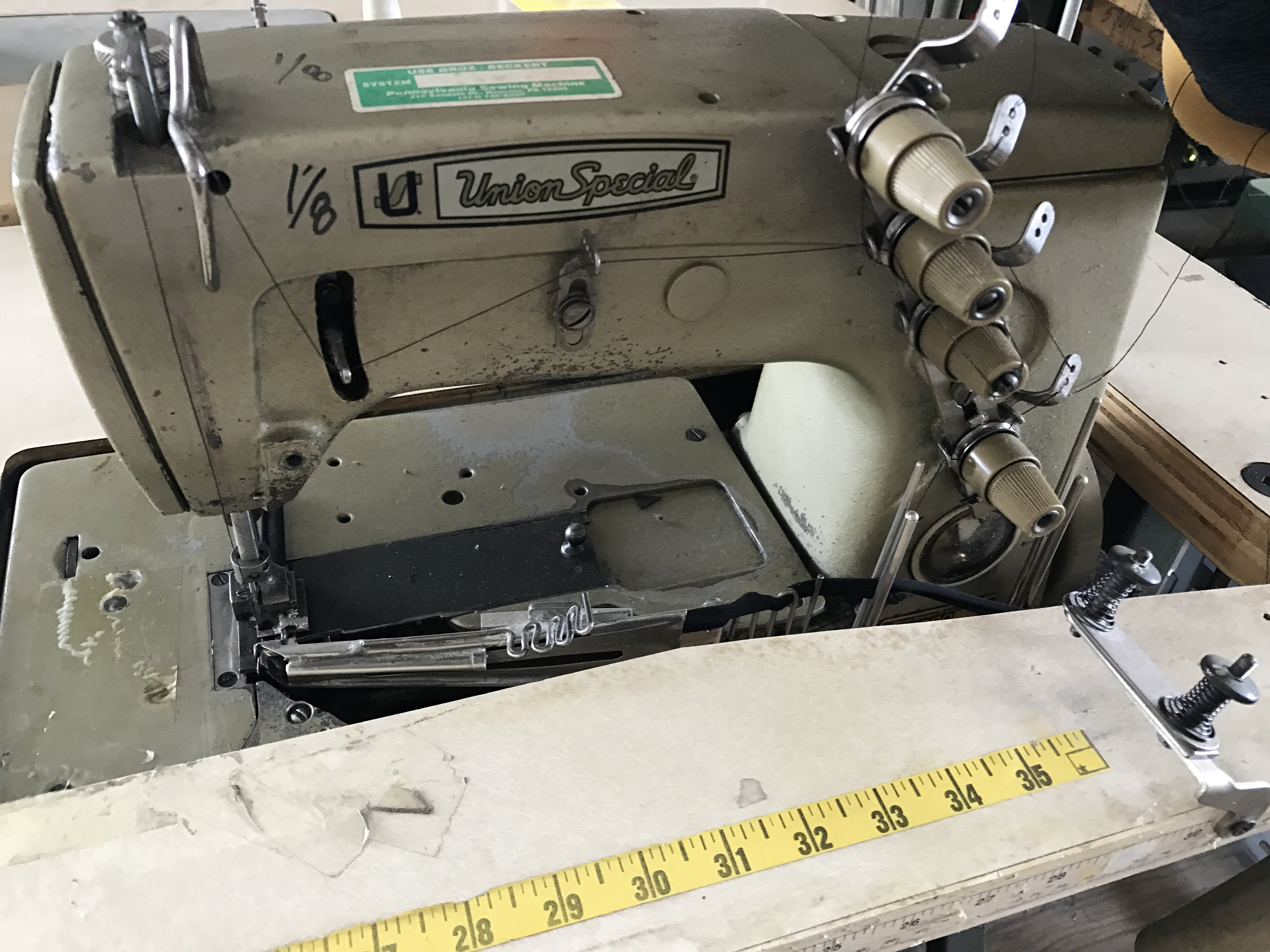 UNION SPECIAL INDUSTRIAL SEWING MACHINE MOD. 57800 W MACHINE WAS BEING