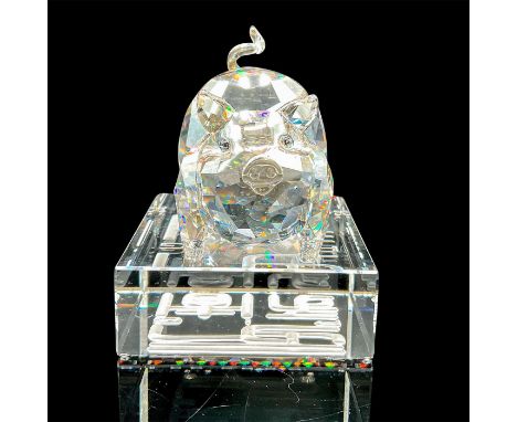 Lead crystal 1st generation pig in crystal silver shade standing atop a crystal base with its zodiac name engraved in a matte