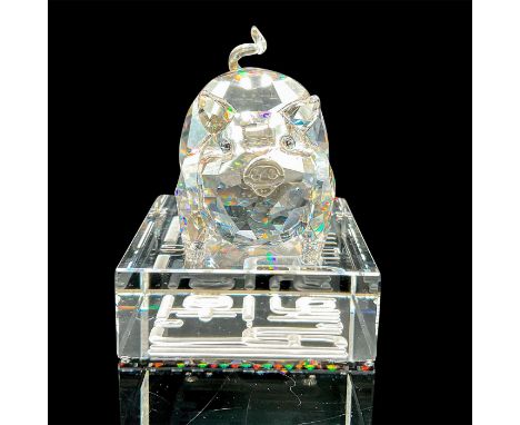 Lead crystal 1st generation pig in crystal silver shade standing atop a crystal base with its zodiac name engraved in a matte