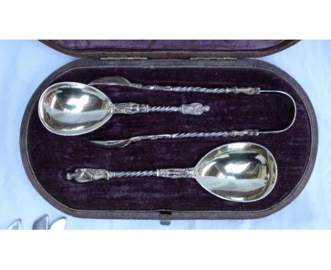 A Victorian silver caddy spoon, sugar spoon and pair of sugar tongs, by Henry Holland, London 1879, with Apostle decoration a